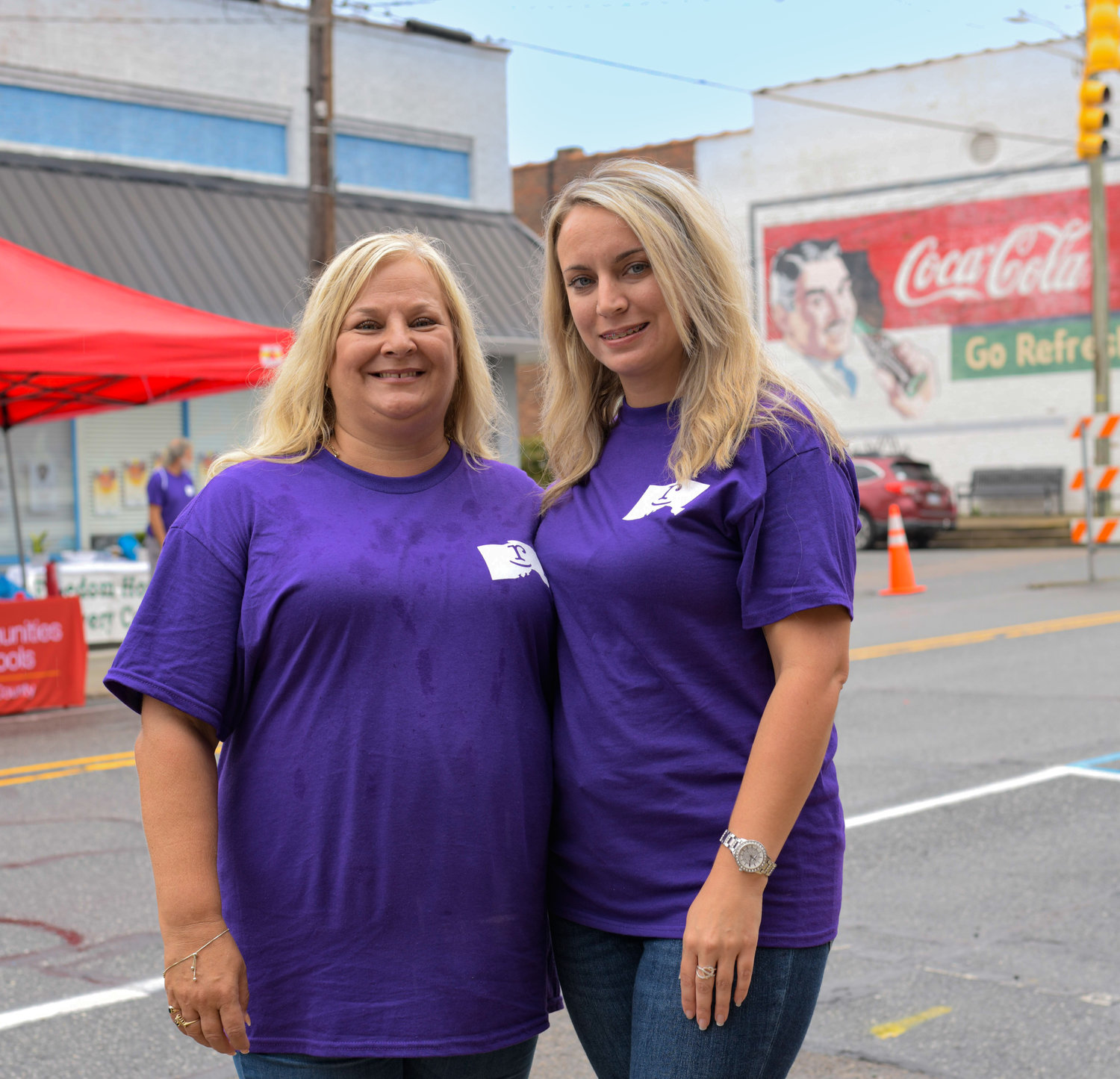 Barbara Berry (left) poses with her daughter Ashley Walters at Chatham County Drug Recovery Celebration in downtown Siler City on Saturday. Berry is approaching the five-year sober mark from her addiction to methamphetamines.